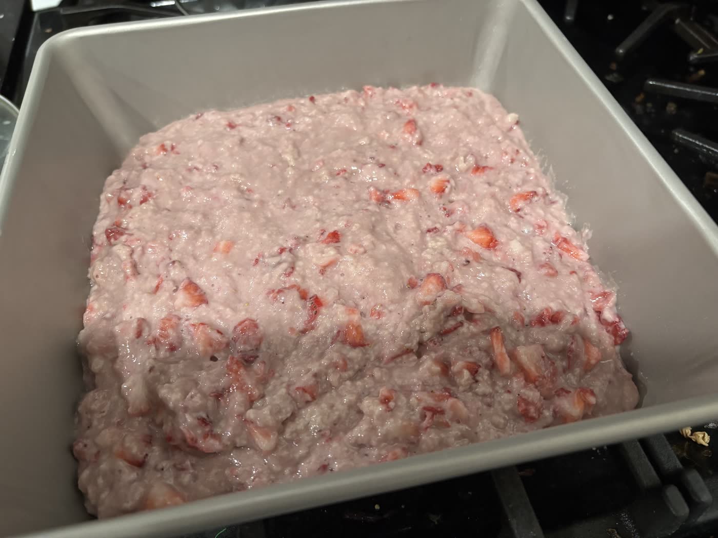 Strawberry bread batter in a loaf pan before baking